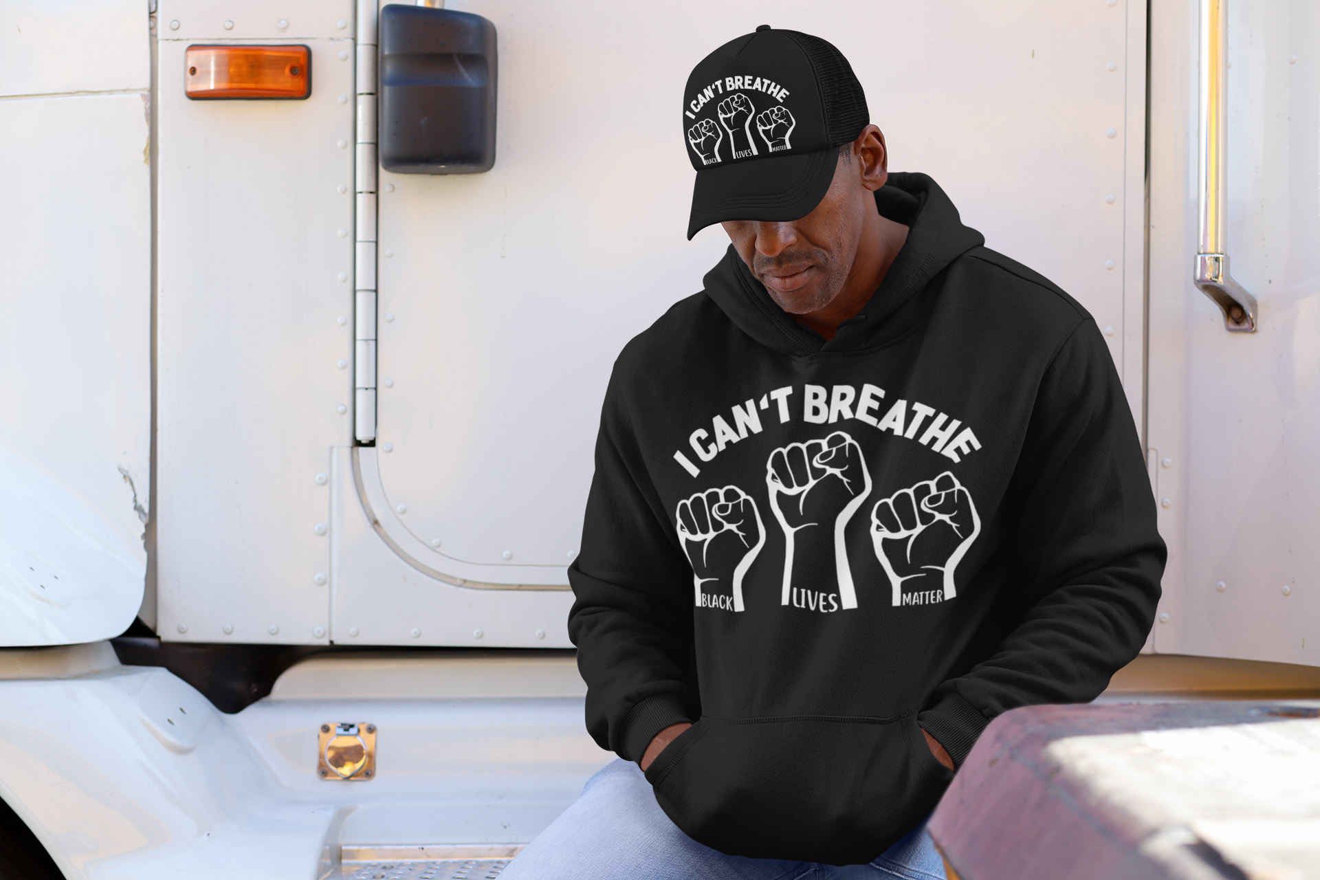 i-can't-breathe-black-lives-matter-hands-up-hat-pullover-hoodie-mockup-of-a-man-with-a-trucker-hat