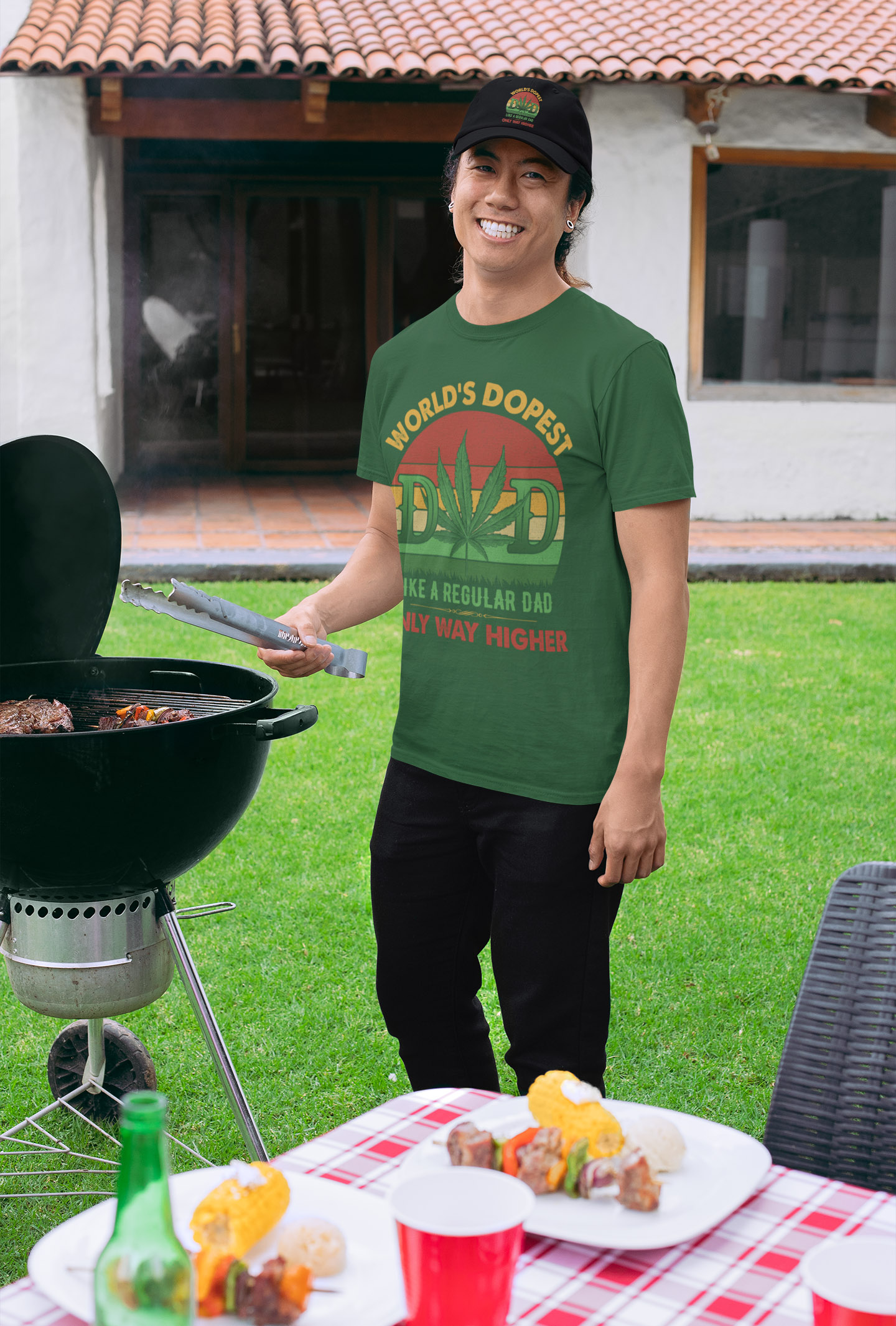 world-dopest-dad-funny-dad-saying-father's-day-t-shirt-mockup-of-a-man-with-a-dad-hat-grilling-at-a-bbq-party