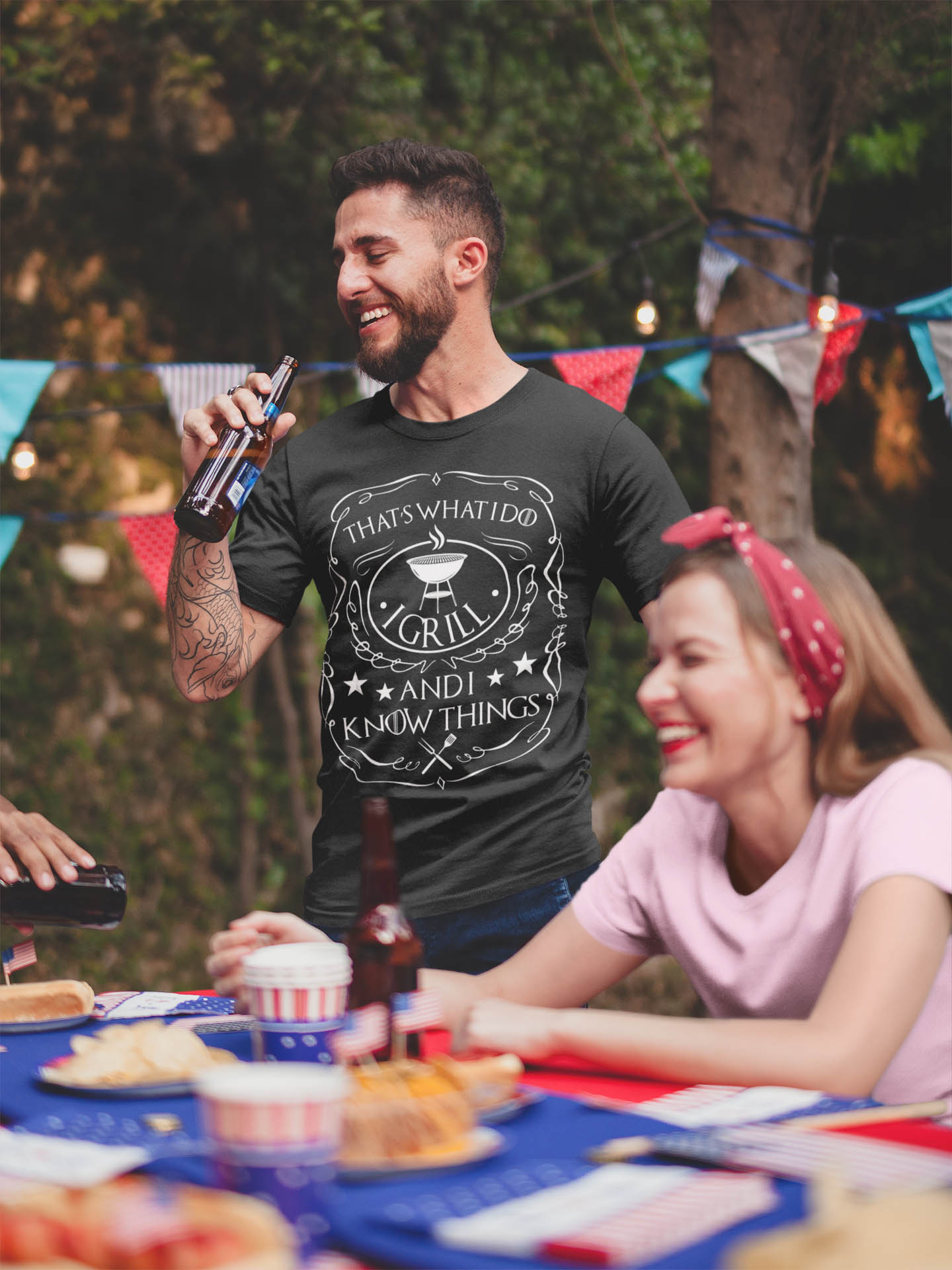 That's What I Do I Grill I Drink I Know Things Barbecue T-Shirt - Funny BBQ Grilling Drinking Saying T-Shirt-tattooed-man-wearing-a-tshirt-mockup-drinking-a-beer-at-a-4th-of-july-bbq-party