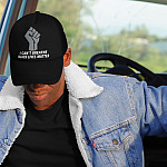 i-can't-breathe-black-lives-matter-trucker-hat-mockup-of-a-man-in-the-cabin-of-a-truck