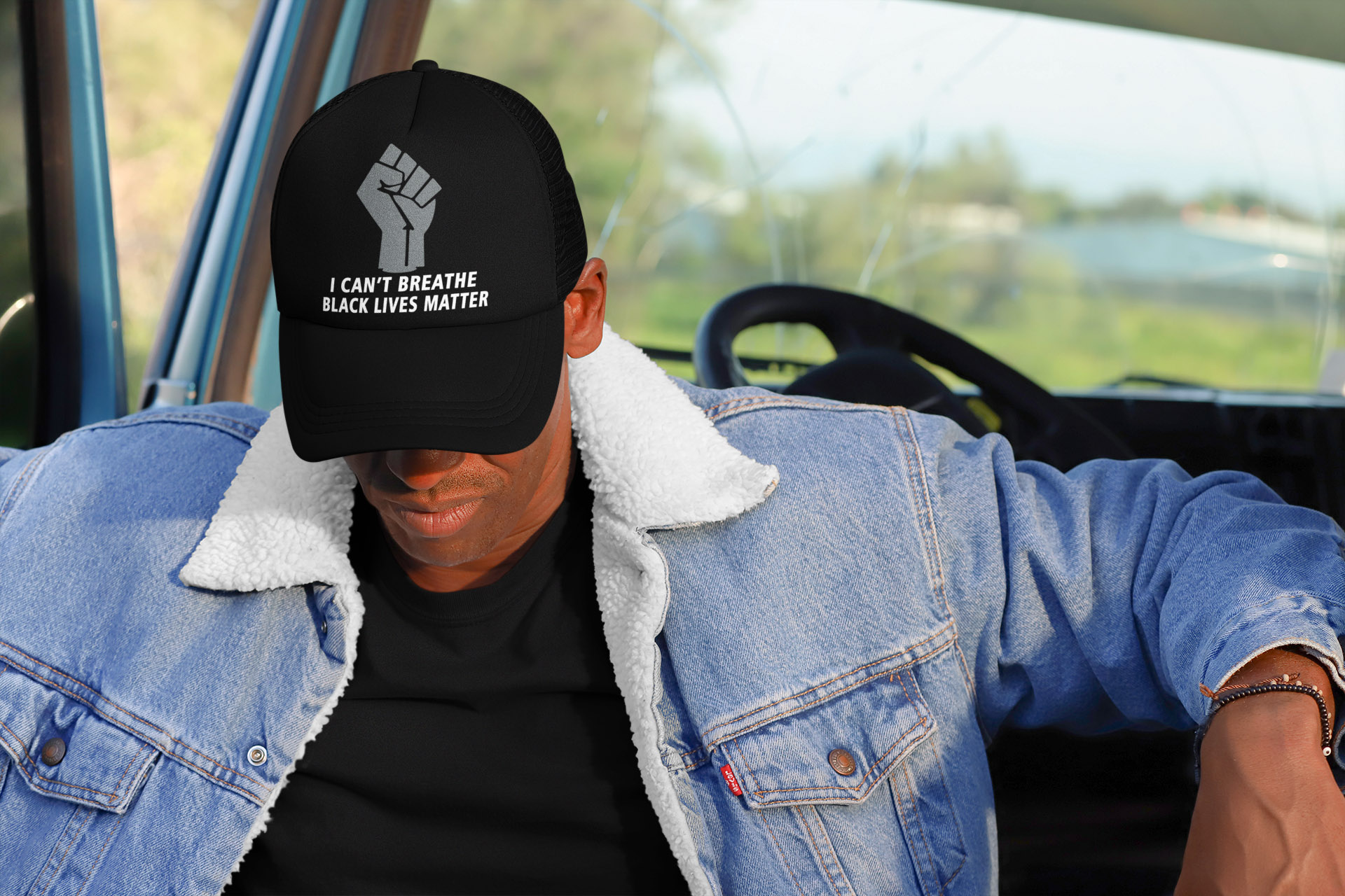 i-can't-breathe-black-lives-matter-trucker-hat-mockup-of-a-man-in-the-cabin-of-a-truck
