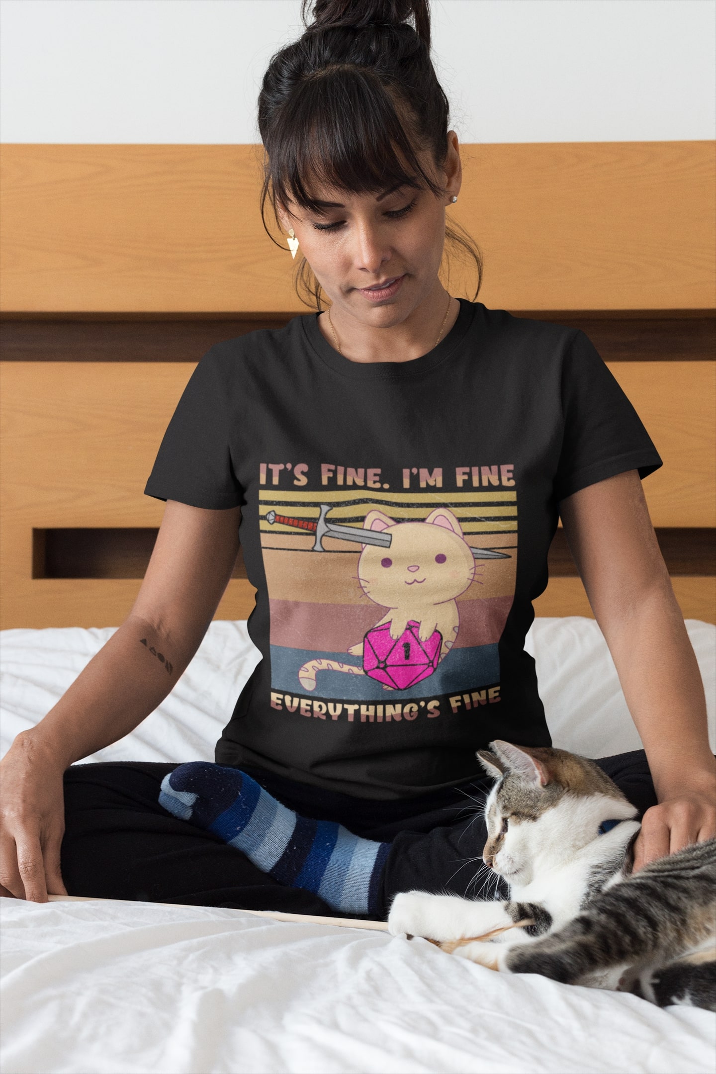 woman-wearing-a-t-shirt-mockup-petting-her-cat-on-bed-a18779