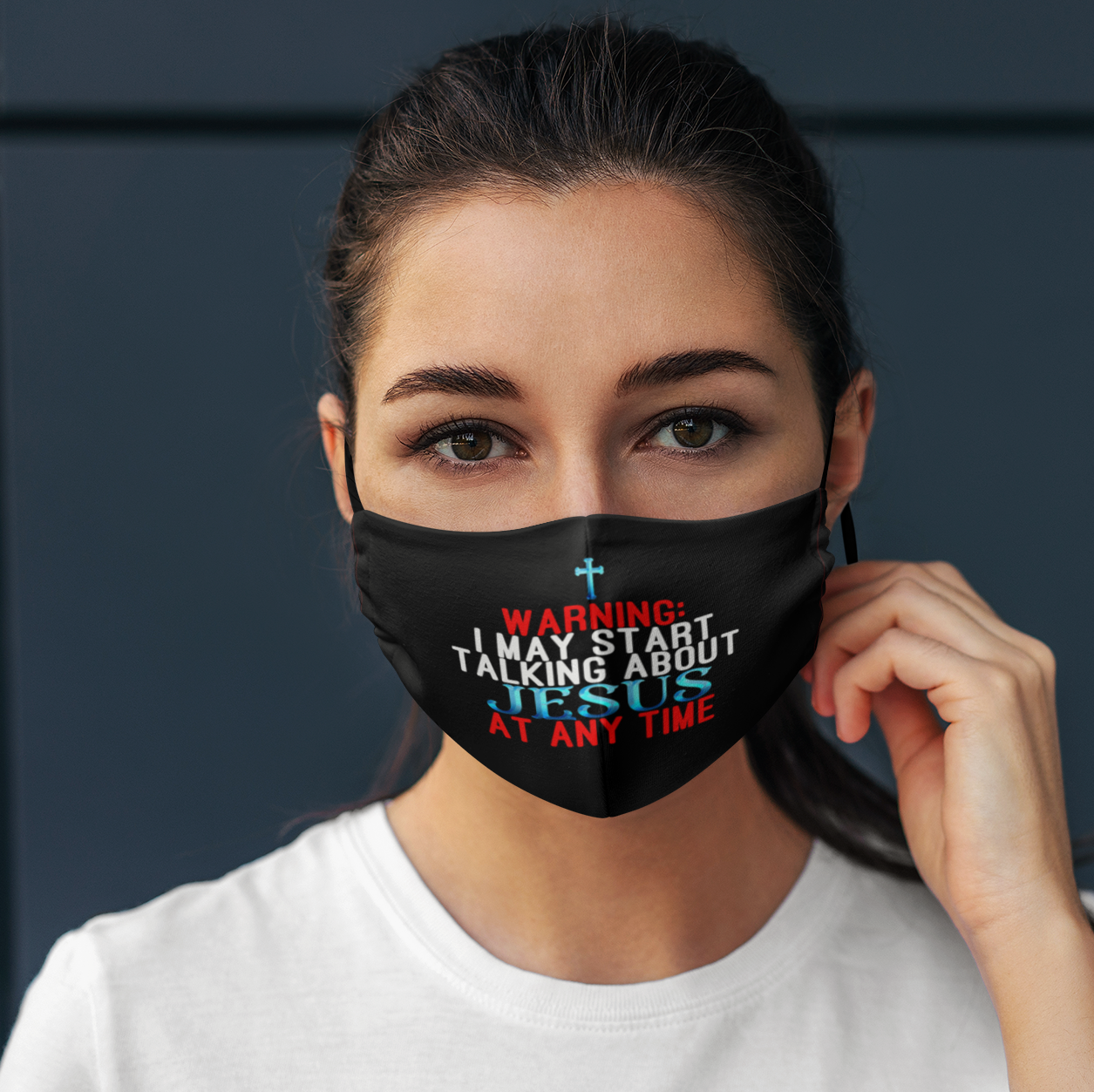 face-mask-mockup-of-a-woman-posing-against-a-dark-wall-4673-el1