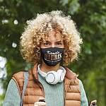 face-mask-mockup-of-a-curly-haired-hiker-in-the-woods-44272-r-el2