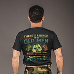 backshot-tshirt-mockup-of-a-middle-aged-soldier-standing-against-a-gray-wall-21257