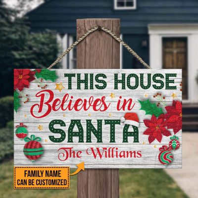 Alternative view of Personalized Family Name This House Believes In Santa Rectangle Wooden Door Sign - Christmas Custom Name Sign