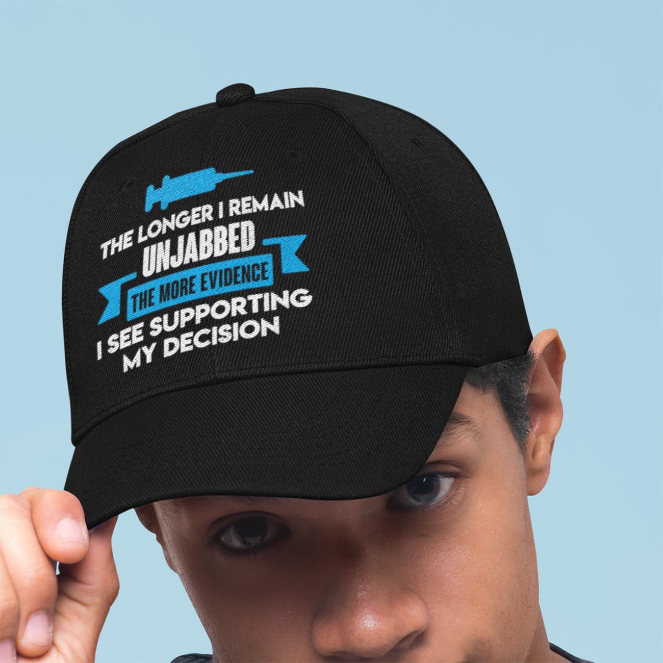 2O. Remain Unjabbed-dad-hat-mockup-featuring-a-young-man-against-a-plain-background-27042 (2)