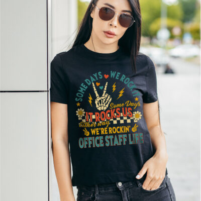 Some Days We Rock It Some Days It Rocks Us Either Way We're Rockin' Office Staff Life Funny Teacher T-Shirt - V-Neck
